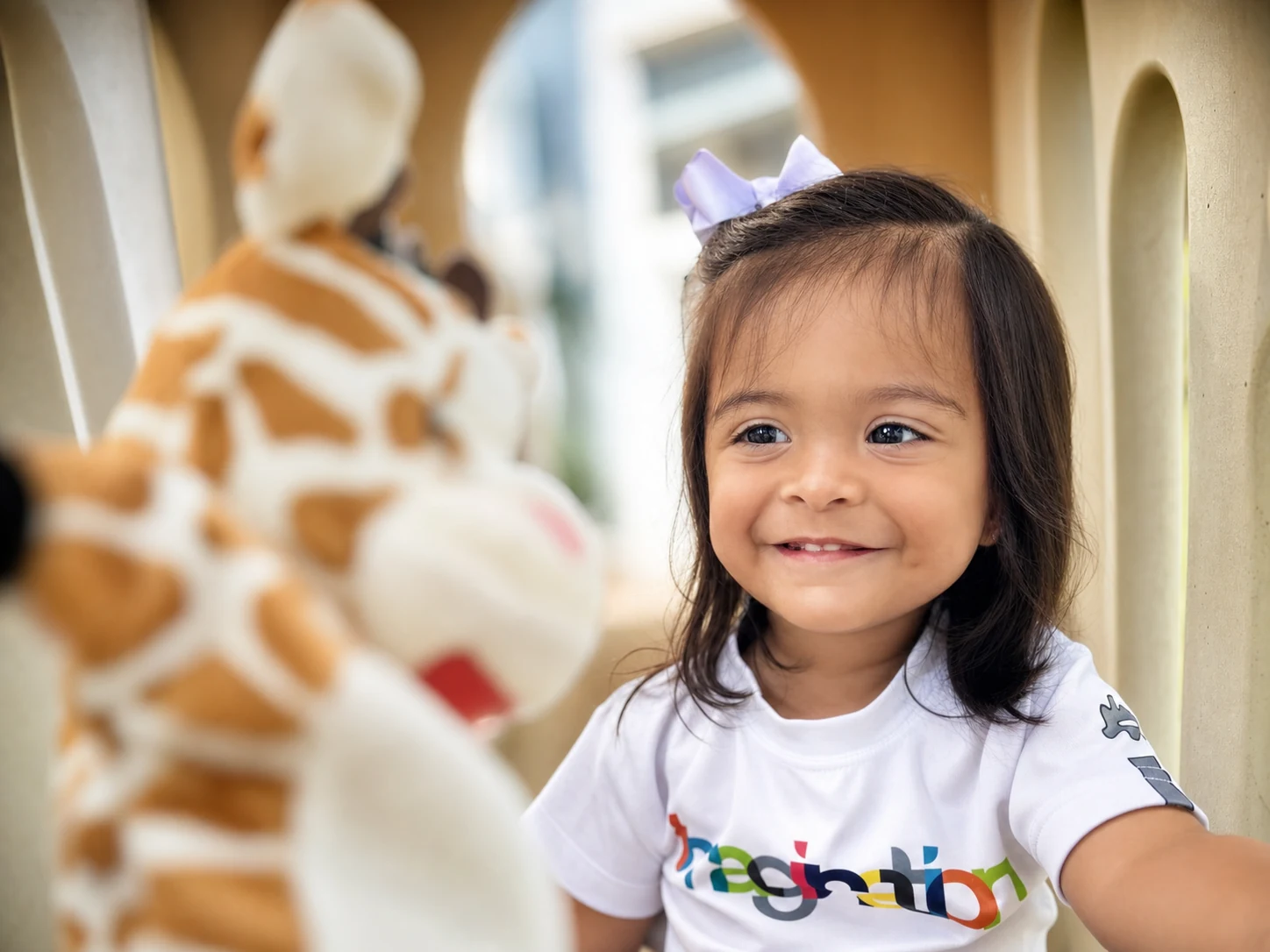 A young child exploring materials in a TIF Playroom