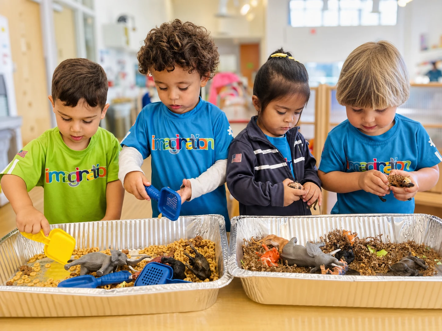 Four children exploring sensory materials together