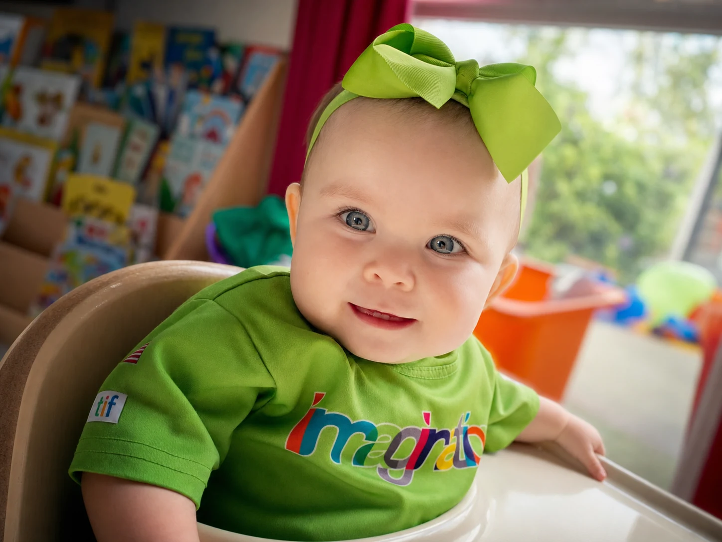 A smiling baby in an Imagination Factory Playroom