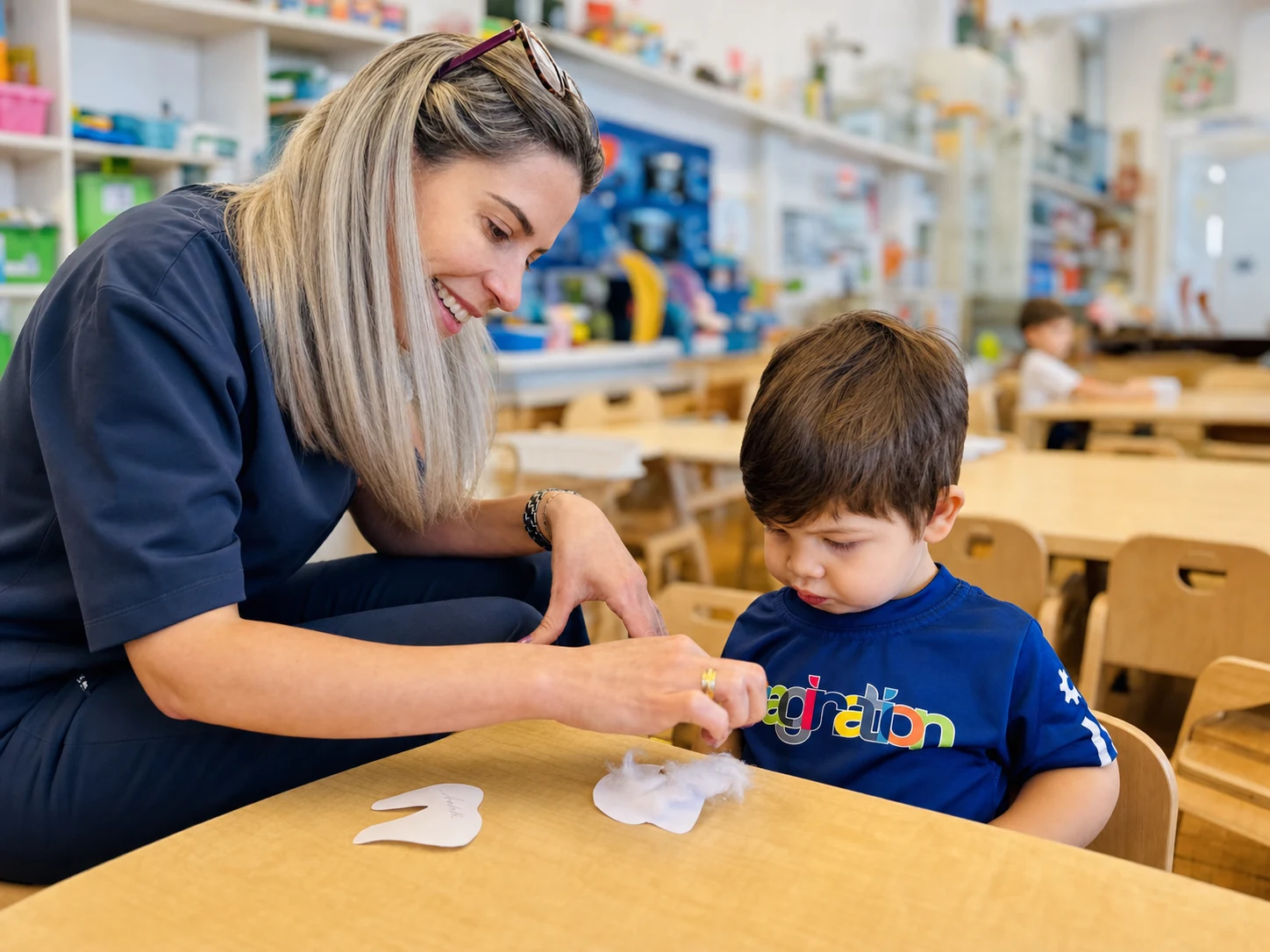 A facilitator encouraging a child's discovery