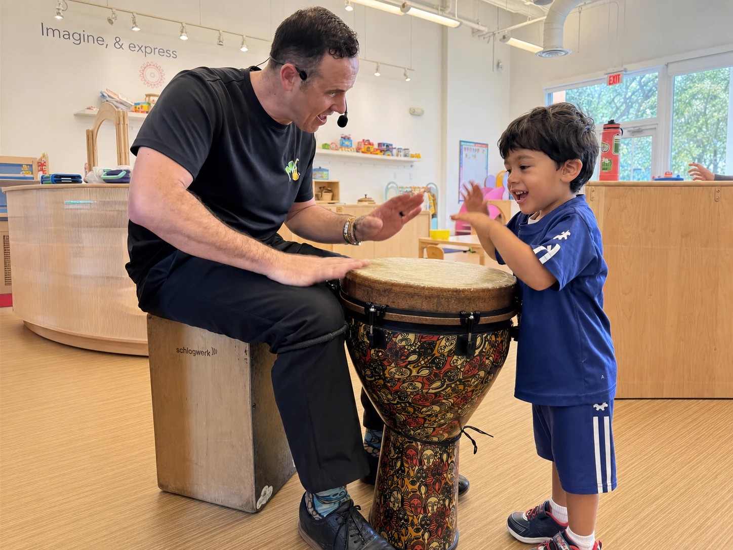 Children exploring instruments, rhythm, songs, and movement with Mr. J